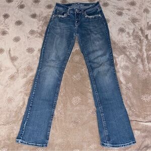 Sexy Couture blue/navy mid-rise boot cut jeans.
Size 7.